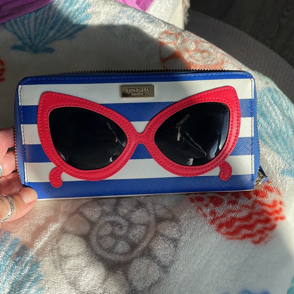 Kate Spade “Make A Splash” red sunglasses on stripes wallet